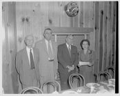 Group of people standing in front of Best Jewelry Co. Est. 1901 clock 